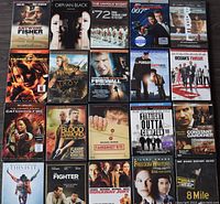 Top view of arranged DVD covers showing movie artwork and titles, mostly drama genre.