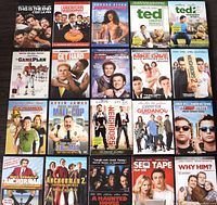 Photo displaying 20 DVD movie cases featuring mostly comedy titles including 'This Is The End','American Wedding','Ted', 'Step Brothers', 'Neighbors 2', 'Anchorman 2', among others.