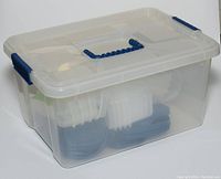 Transparent storage bin containing assorted stacked plastic food containers and blue lids, shown from the front and side.