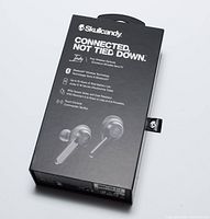 Packaged Skullcandy Indy earbuds box showing product image and key features on front.