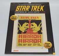 Front of sealed Star Trek poster calendar showing 'Mirror Mirror' themed January print by Juan Ortiz with easy detach and frame instructions.