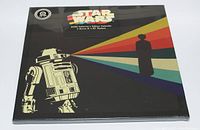 Front cover of the sealed Star Wars 2020 calendar featuring R2-D2 and rainbow colored stripes.