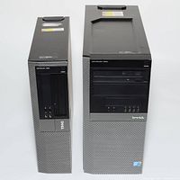Front view of Dell Optiplex 980 SFF (left) and Optiplex 960 Tower (right) desktops showing power buttons, optical drive bays, USB ports and Dell logos.
