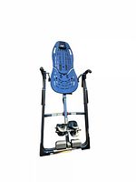Full length view of blue and black Hang Ups back teeter stretcher showing frame, foot rests, and back support.