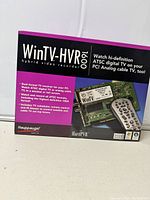 Box front showing WinTV-HVR-1600 branding, capabilities for digital ATSC and analog TV recording, and features.