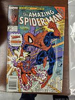 Full front cover image of The Amazing Spider-Man comic book issue #327 from 1989 showing Spider-Man and Magneto fighting, colorful Marvel branding and issue details visible.