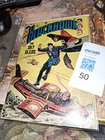 Front cover of Blackhawk No. 74 comic showing colorful action scene featuring sky sled flying vehicles with title and issue details, condition shows visible wear and creasing