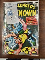 Front cover of the 1967 Unknown Challengers comic #57, showing colorful action artwork and title text.