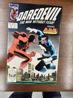 Full cover of Daredevil No 257 comic featuring Daredevil and Punisher in confrontation.