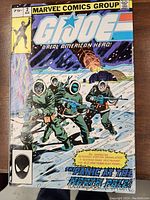 Front cover of the G.I. Joe No. 2 comic book showing soldiers in winter gear, weapons, and snowy battlefield scene with Marvel Comics Group branding.