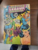 Front cover of the Justice League of America No. 66 comic showing main characters Batman, Superman, Wonder Woman, Green Lantern, and Aquaman, with a price of 12 cents dated November.