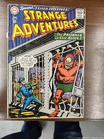 Full cover image of Strange Adventures No. 177 showing illustration of a monster in a prison cell with a guard and text bubble.