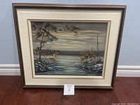 Front view of framed oil painting titled 'North of Superior #3' by A. Austin on wall with floor beneath