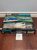 Box of Revell Monogram 1/25 scale plastic model kit showing images of the 1967 and 1997 Corvette coupe models. Original plastic parts still sealed inside box.