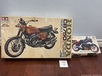 Box top featuring image of Honda CB750 Four motorcycle model kit and smaller Walter Wolf Racing special edition box
