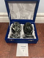 Two heavy black marble wine glasses in original blue box with white satin interior hold.