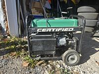 Front right side view showing green fuel tank, black frame, engine housing and wheel