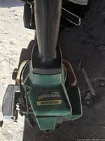 Top view of green motor housing labeled Weed Eater Featherlite Plus