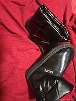 Side and upper view of black synthetic women's boots with SPORT and TROPS branding