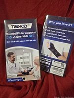 Single box of Tismod Thumb and Wrist Support Adjustable for right hand, showing front and back of packaging with product features and benefits.