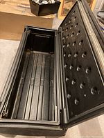 Photo of the open chest showing the interior and reinforced lid.