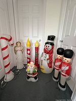 Group shot of all eight blow molds against a door