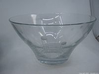 side view showing flared shape and etched design