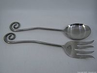 Fork and spoon full view showing spiral handles