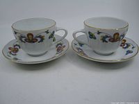 Both teacup and saucer pairs front view