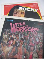 Front covers of Rocky and The Warriors videodiscs