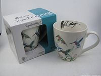 Mug showing design and box