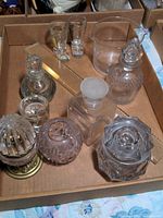 Overview of all items including decanters, ruler, wine rinser, lighter, shot glasses, and storage containers arranged in a box