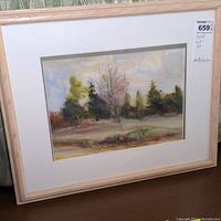 Framed watercolor landscape artwork showing the full piece with double matting and signature.