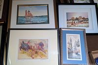 Four framed and matted watercolours displayed together showing sailing ship, cityscape, canal scene, and abstract figures and animals