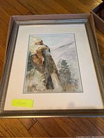 Full view of watercolor painting in broad silver-tone frame with natural landscape theme.