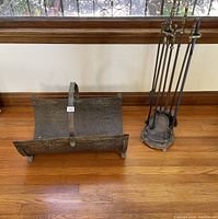 Side view of the timber basket and fire tools set on stand showing scale and condition