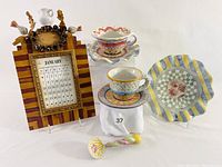 Image showing the two cups and saucers, decorative plate, perpetual calendar, and ceramic knob arranged together