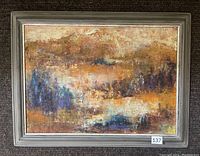 Front view of the oil on canvas painting showing abstract landscape in earth tones, framed in light grey wooden frame.