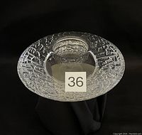 Top view of the textured glass votive showing the wide patterned rim and the smooth central holder.