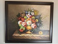 Frontal view of the framed floral oil on canvas painting displaying the full artwork and frame.