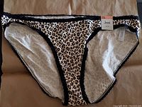 Front view of 3XL Jenni bikini bottom with cheetah print and black lace trim, new with tag visible.