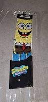 Front of the SpongeBob socks showing face and outfit design