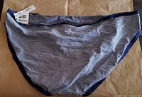 Front view of navy and white thin stripe bikini bottom with scalloped edge trim and tagged size 3XL.