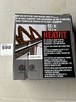 Box showing the Heat It roof and gutter de-icing heating cable kit, 60 feet long, pre-assembled and ready to install.