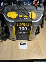 Front view of the Stanley FatMax booster pack showing brand, amp ratings, and USB port covers.