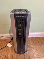 Front view of Envion Four Seasons air purifier tower showing main air vent and overall unit design.
