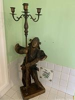 Front view of the spelter samurai figure holding the candle holder, showing full length and base.