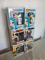 Six Pop Rocks collectible figures stacked in two columns, all sealed in original packaging. Top two figures are Hatsune Miku #39, middle left Janet Van Dyne #344, middle right Ant-Man #1137, bottom left Cell (First Form) #947, bottom right Black Adam #1232.