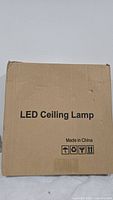 Box labeled 'LED Ceiling Lamp' made in China.