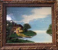 Full view of framed glass painting showing cottage landscape with lake and sky